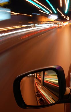 Figure 2. Photo. A time-lapsed view from driver's window of a road at night.