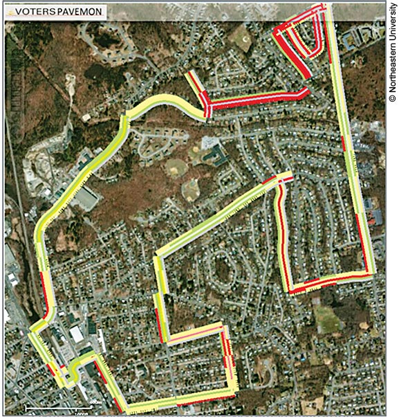Satellite view map overlaid with pavement monitoring (PAVEMON) system data. The PAVEMON data is represented on the map by a colored line (mostly yellow, with some red and green areas) overlaid on the area of the map encircling the research area; the different colors represent different road conditions.
