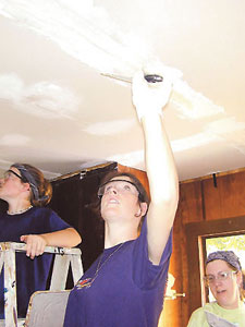 A TFHRC employee led a student volunteer group that helped to repair homes for families in southeastern Virginia during Work Camp 2004