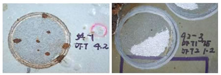 Figure 18. Photo. Cohesive failure modes of ASP and EM. This photo shows the coating surface on polyaspartic (ASP) and epoxy mastic (EM) panels after adhesion strength testing was performed. Both these coating systems demonstrated cohesive failure modes, meaning that the coating system had an adhesively well-bonded primer to the steel substrate in comparison to the adhesion bonding between the coating layers. ASP had a remaining dry film thickness (DFT) of 4.2 mil (106.68 ), and EM had a remaining DFT of 1.5 mil (38.1 ) on the surface. 