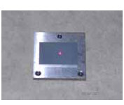 Figure 73. Photo. Calibration surface plate on top of base plate. This figure shows a photograph of the calibration surface plate placed on top of the base plate.