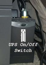 Figure 10. Photo. UPS on/off switch. This figure shows a photograph of the on/off switch for the UPS.