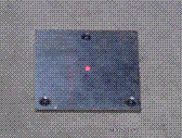 Figure 32. Photo. Laser dot centered on base plate. This figure shows a photograph of the laser dot from the laser sensor centered on the base plate.