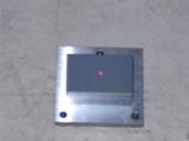 Figure 35. Photo. Block on top of base plate with calibration plate on top of block. This figure shows a photograph of the calibration block placed on top of the base plate, with the calibration surface plate placed on top of the block.