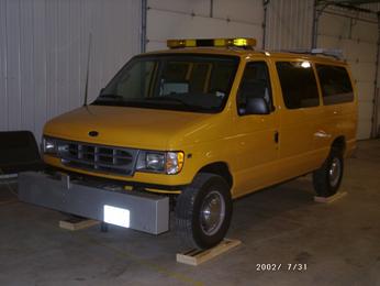 Figure 71. Photo. Profiler on top of support blocks. This figure shows a photograph of the profiler with all four tires resting on top of blocks.