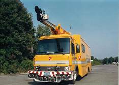 Figure 6.9. Photo. Photographic distress equipment van, front view, with extended overhead camera boom.