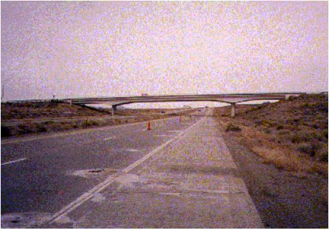 This photograph shows the test site, which consists of a divided highway’s eastbound lane, which passes under an overpass.