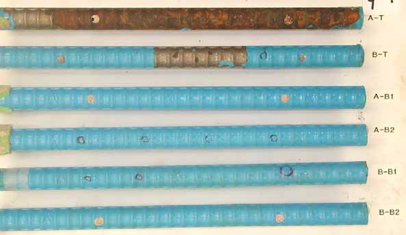 Figure 71. Slab #9 after autopsy. Photo. After autopsy, a top mat ECR (A-T) is completely delaminated revealing severe corrosion of substrate, and the other top mat ECR (B-T) is still coated blue with one major delamination spot, but no corrosion underneath. The four bottom mat ECRs look good without coating deterioration.