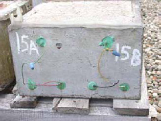 Figure 87. Slab #15 front, rear, and top views with specifications. Photos. (A) Slab number 15 front view shows the 15A label on the left and 15B on the right. The green bars and the concrete look clear with no corrosion. Wires connect the top and bottom bars of 15B; the same is true for 15A. 