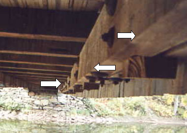 The picture shows negative camber or sag in the bottom chord of this bridge in excess of 457 millimeters (18 inches).