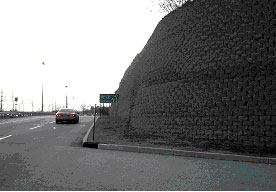 Figure 4. Photo. Example applications of SRW systems. Photo c is of a SRW wall in a commercial center.