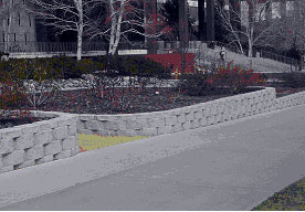 Figure 4. Photo. Example applications of SRW systems. Photo e is SRW wall used for landscaping.