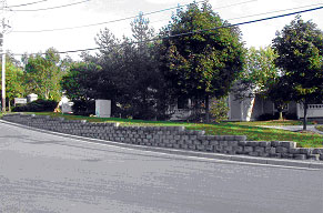 Figure 4. Photo. Example applications of SRW systems. Photo f is a SRW wall used in a residential area.