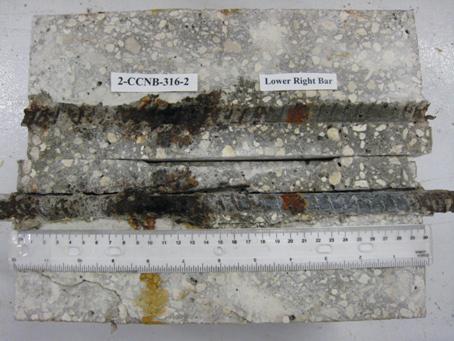 Figure 93. Photo. Lower R bar and bar trace of specimen 2-CCNB-316-2 subsequent to dissection. This is a photograph of a lower R bar and bar trace of specimen 2-CCNB-316-2 subsequent to dissection showing extensive corrosion.