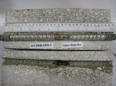 Figure 97. Photo. Top R bar and bar trace of specimen 4-CSDB-SMI-1 subsequent to dissection. This is a photograph of a top R bar and bar trace of specimen 4-CSDB-SMI-1 subsequent to dissection showing corrosion.