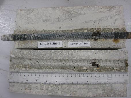 Figure 103. Photo. Lower left BB and bar trace of specimen 6-CCNB-304-1 subsequent to dissection. This is a photograph of a lower left BB and bar trace of specimen 6-CCNB-304-1 subsequent to dissection. Some corrosion is apparent.