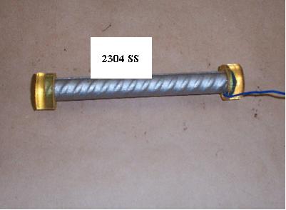 Figure 6. Photo. Straight as-received 2304 SS bar with epoxy-mounted ends and an electrical lead. The photo, taken from above, shows a straight bar with a white label illustrating the bar type, 2304 SS. The length of the bar is 152 mm, and the size is #5 (16-mm diameter). The bar is metallic blue, and each end has an amber-colored epoxy cap cast on it. The right end of the bar shows a blue wire electrical lead that was attached directly to the bar end and sealed with the epoxy cap.