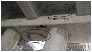 Photo. Concrete spalling beneath cap beam of eastern approach to Llacolen bridge. Click here for more information.