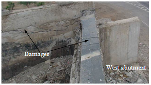 Photo. Back wall and wing wall damage at west abutment of Romero bridge. Click here for more information.