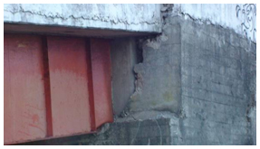 Photo. Punching of Tubul bridge deck into back wall. Click here for more information.