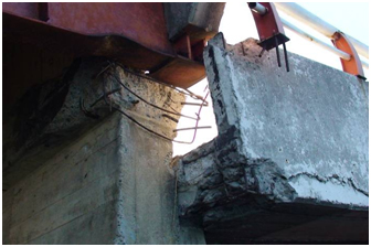 Photo. Bottom flange buckling and concrete spalling on Tubul bridge. Click here for more information.