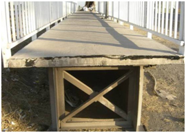 Photo. Damage to girder supports of Itata River bridge. Click here for more information.