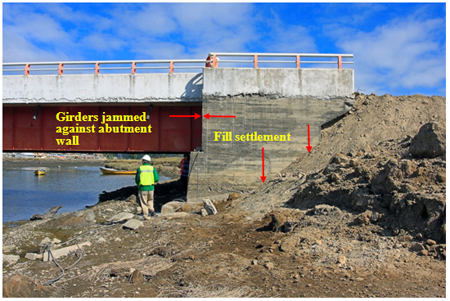 Photo. Abutment fill settlement at northwest abutment of Raqui 1 bridge. Click here for more information.