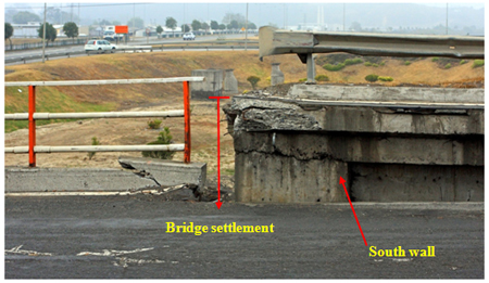 Photo. Close-up of settlement of approach structure for Juan Pablo II bridge. Click here for more information.