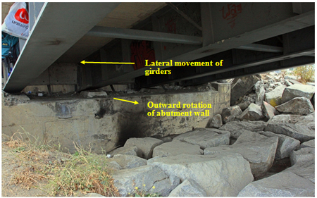 Photo. Tilting of northeast abutment pier wall of old Biobío River bridge. Click here for more information.