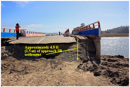 Photo. Southeast approach fill damage at Raqui 2 bridge. Click here for more information.
