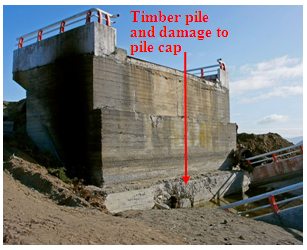 Photo. Overview of damage to south abutment of Tubul bridge. Click here for more information.