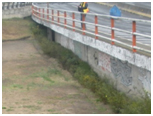 Photo. North retaining wall at Juan Pablo II. Click here for more information.