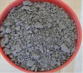The image shows the “as received” Spratt limestone aggregate used in mix designs. The “as received” aggregates were assessed and crushed if necessary to fit ASTM C1260 grading requirements before being used to create concrete prism samples under the ASTM C1293 testing procedure.