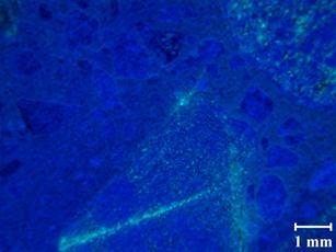 A typical petrographic image for recast Mix 4 at 62 days shows the fluorescence is even more common and consistent with the increase in nonlinearity.