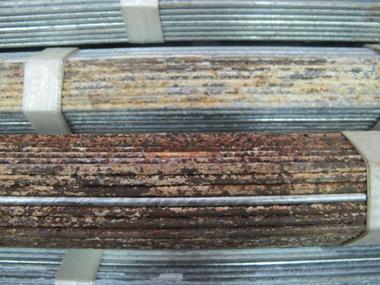 This photo shows the north side of cable pre-corroded strand and adjacent side of a separate strand. The 1-ft (0.30-m) area of the adjacent strand highlights the onset of corrosion resulting from the contact with the pre-corroded strand. 