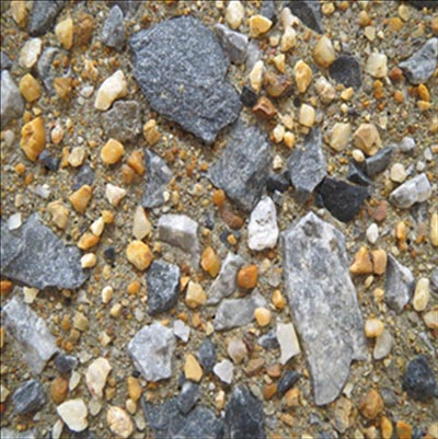 The photo shows the type of concrete surface obtained with a medium concentrated (in-form) retarder, where the fine aggregate (sand) particles and some of the coarser aggregate particles are exposed after pressure washing the paste fraction of the concrete surface.