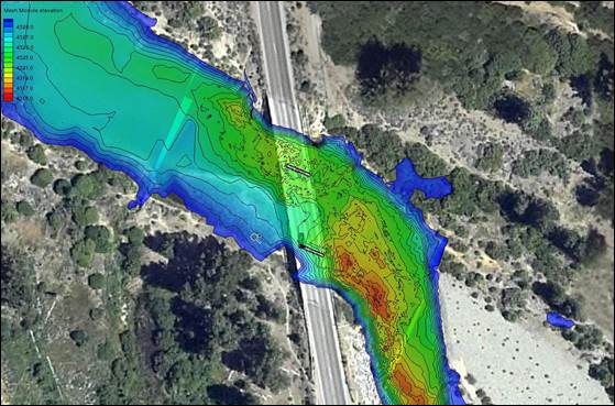 Figure 28. Photo. River bathymetry in 2013 after riprap installation. This aerial photo shows the river with the bridge and superimposes the 2013 bathymetry information. These data show a leveling out of depth around pier 3, but deeper scour approaching the other pier.