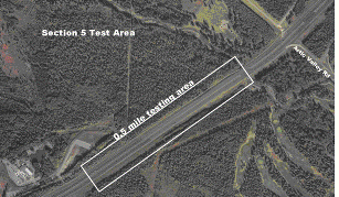Figure 23.  Photograph.  Test section 5.  An aerial photograph illustrates the location of test section 5 on the Glenn Highway State Route 1 outside Anchorage, AK.  The testing area is located on a straight section of the highway.  There is an interchange with Arctic Valley Road approximately 0.2 mi beyond the test section at the top of the photograph.  The test section is approximately 0.5 mi long.