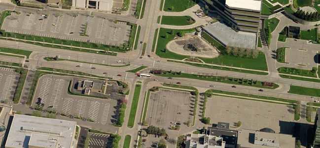 The photo shows a restricted crossing U-turn intersection in Troy, MI.