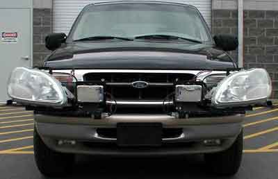 Photo. Headlamp setup on black SUV with hybrid UV–A and HID. Click here for more detail.