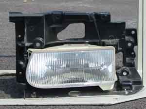 Photo. Front view of halogen headlamp (low/narrow). Click here for more detail.