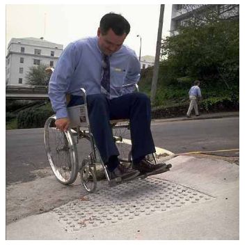 A pavement grinding project left an exaggerated lip at this curb cut.