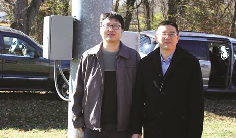 Photo of University of Mississippi Researchers Dr. Li Zhang and Zhitong Huang at the TFHRC Intelligent Intersection