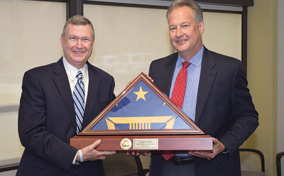 Dr. Joseph I. Peters (left) receiving his retirement commemoration award from FHWA Executive Director Jeff Paniati.