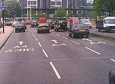 Photo of pavement markings indicating road junctions ahead in England