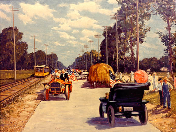 Image: Automobiles and wagons travel on a concrete road.