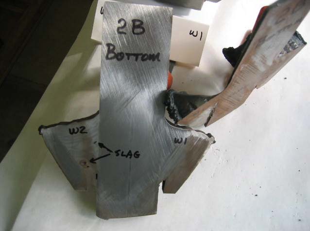 Figure 24: The bottom of the pile connection plate weld 2B. Slag inclusion found 3 mm from weld end. Another saw cut taken 13 mm from end showed no slag. 