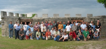 Photo of Archeological Workshop attendees gathered for a group photo in front of the Fort Frederica National Monument.