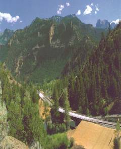 Photo of a bridge over a river in a mountain valley. Courtesy of Wyoming DOT.