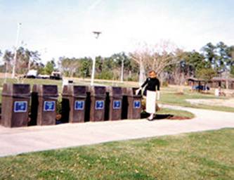 ;  Photo of a row of recycling receptacles that NC DOT provides at rest areas and welcome centers.
